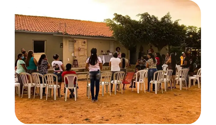 Comunidade reunida em roda no sertão durante ação missionária